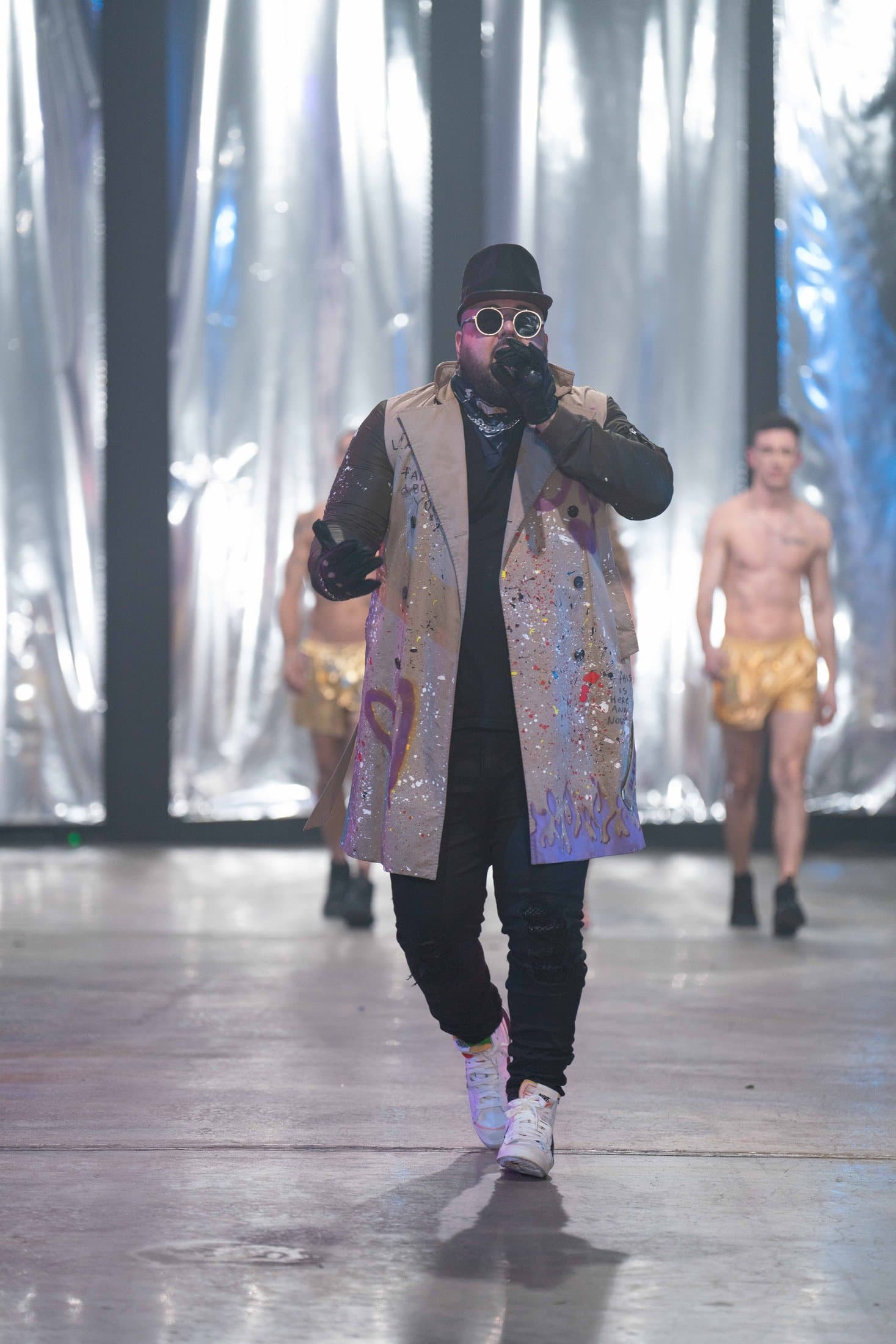 Armando walking a fashion runway